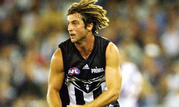 Shane O'Bree showcases Collingwood's pre-season jumper circa 2001-2004 in the third round of the 2001 Ansett Cup against North Melbourne at Colonial Stadium.