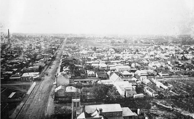 An overhead view of the suburb of Collingwood with Victoria Park in the distance (1880s).
