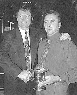 Tony Shaw accepts the Most Courageous award from board member Wayne Richardson in 1994.