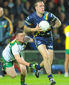 Dane Swan of Australia in action against Leighton Glynn of Ireland during the Irish Daily Mail International Rules Series 1st Test between Ireland and Australia at the Gaelic Grounds, Limerick in 2010.