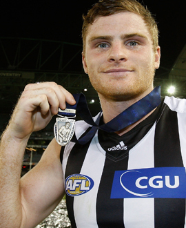 Heath Shaw proudly shows off the Michael Tuck Medal in 2011.