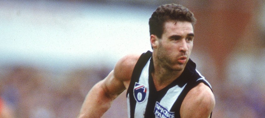 James Manson in action during a 1991 AFL match at the Melbourne Cricket Ground.