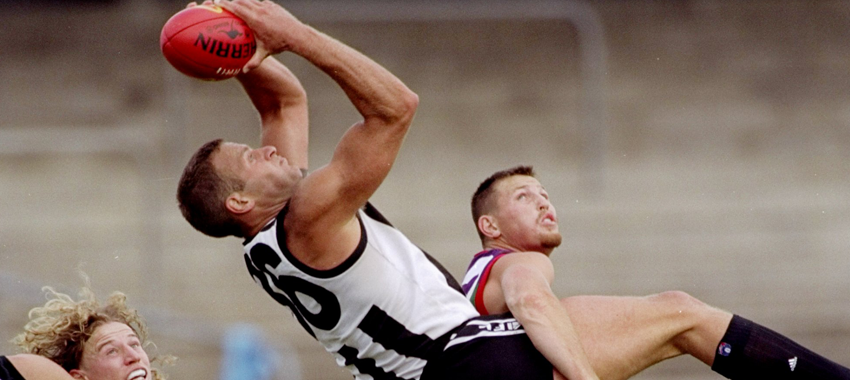 Saverio Rocca flies for a mark in a practice match against Fremantle in 1998.