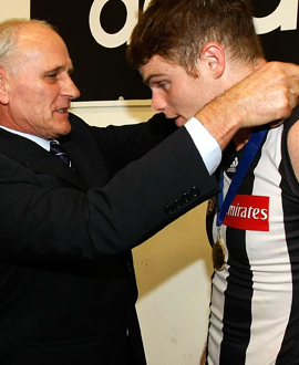 Heath Shaw is presented with the Rose-Sutton Medal by Charles Sutton Junior after the round six win in 2011.
