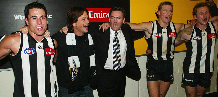 The team sing the song alongside actor Rob Lowe, president Eddie McGuire and captain Nathan Buckley in the win over St Kilda in round, 2003.